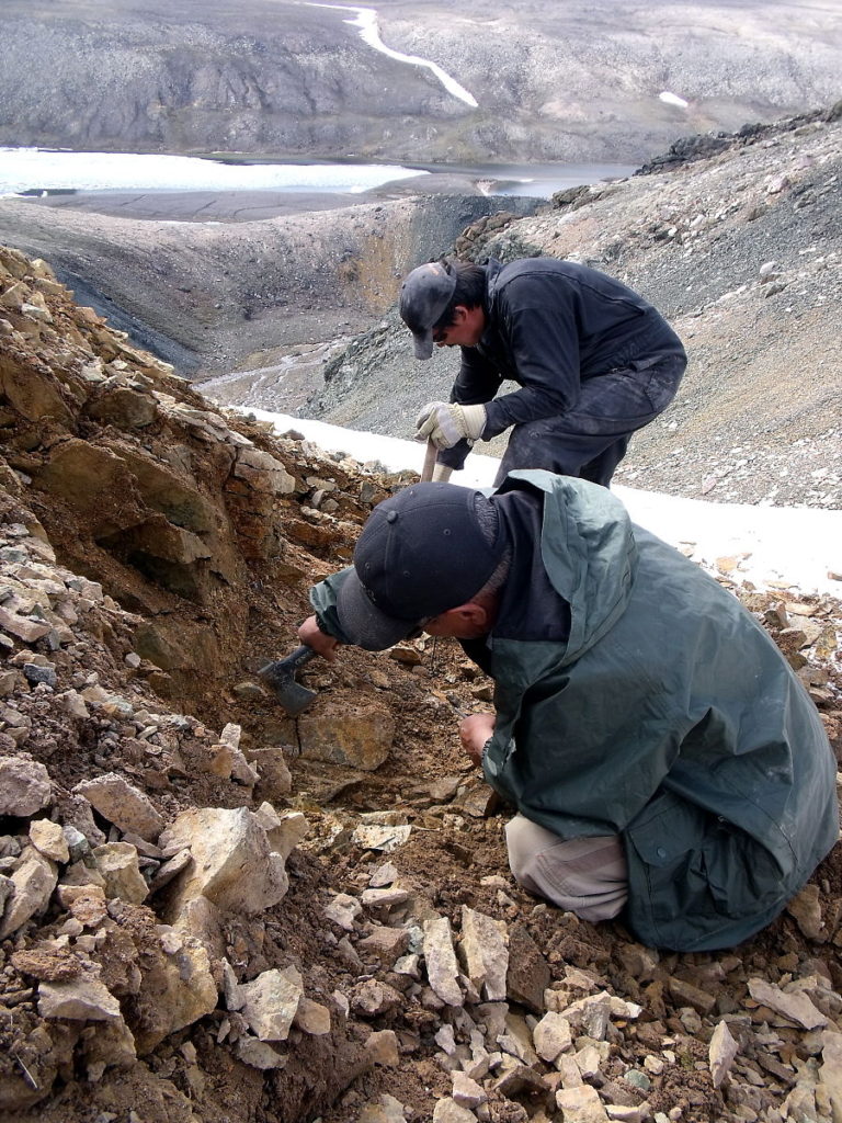 A picture of carvers Moses Koonark and Jerry Ell mining soapstone